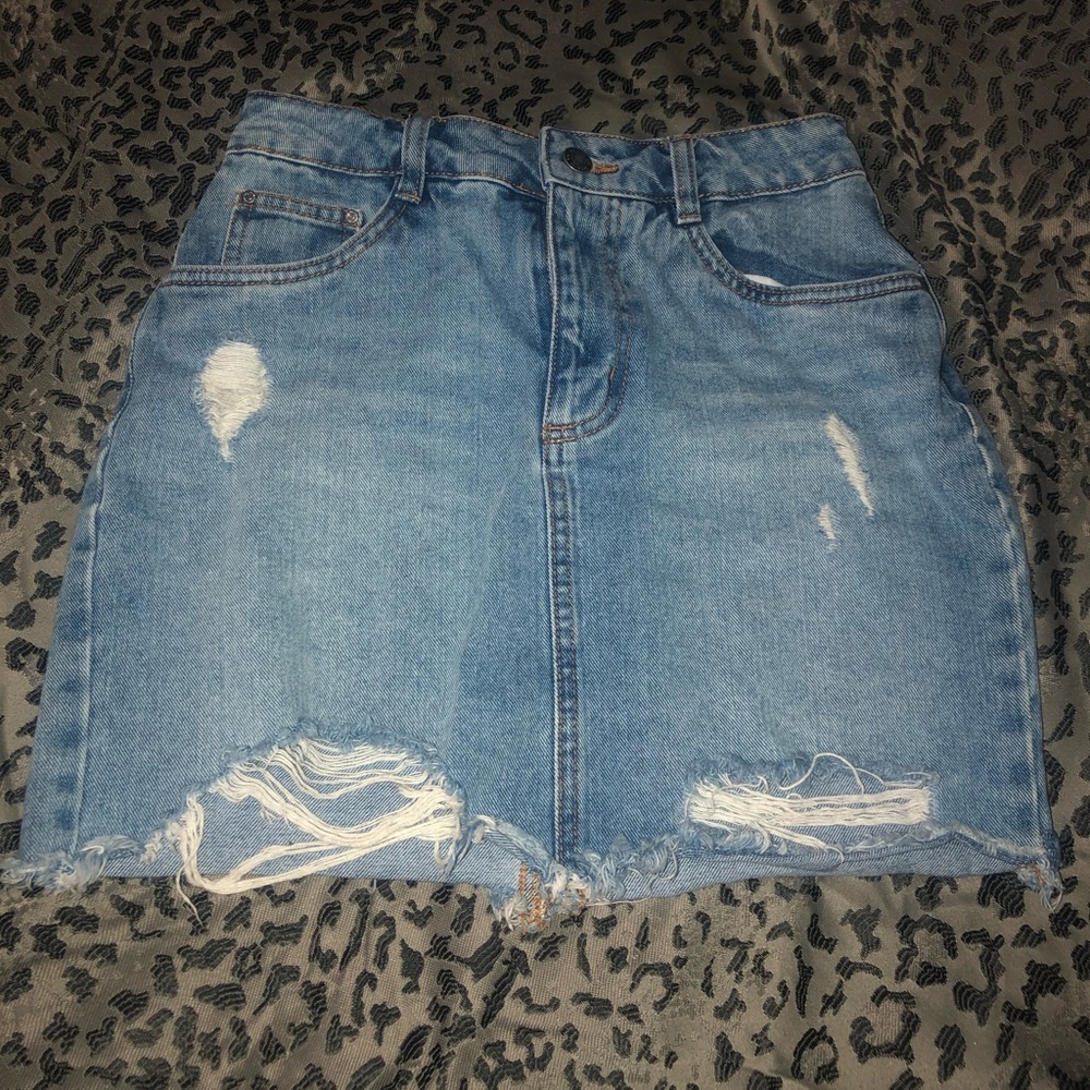 Distressed denim mini skirt